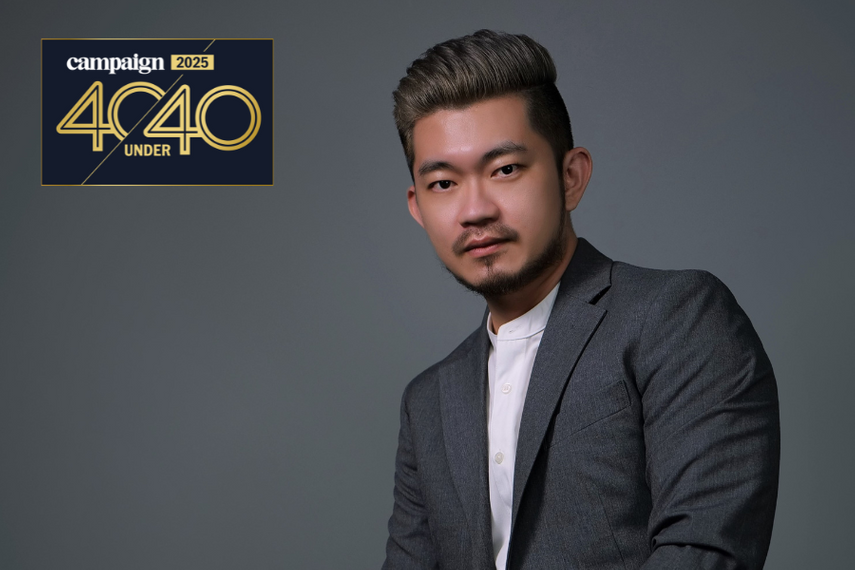 A professional portrait of a man in a grey suit against a plain background, featured with the Campaign 2025 40 Under 40 logo
